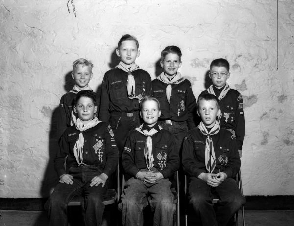 Seven members of the Shorewood school Cub Pack 307 who received the Webelos award posing for a group portrait. Seated, left to right, are; Bob Dutton, Richard Gregg, and Bill Conway. Standing, left to right, are: Jim Arnold, Bobbie Lenz, Tom Combs, and Fred Fitschen.