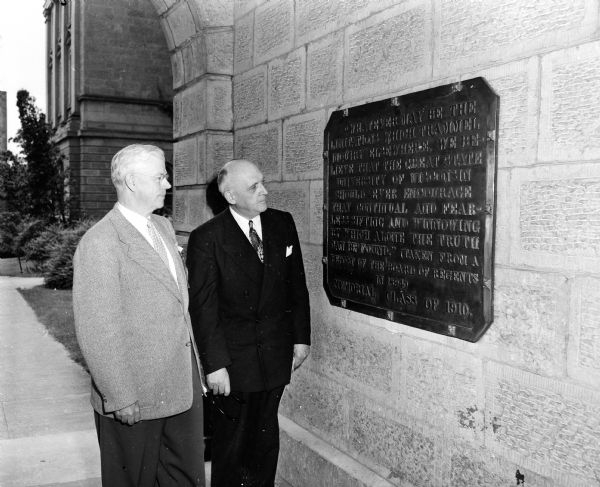 F. Ryan Duffy (left) U.S. Circuit Court Judge of Chicago presents Class of 1910 rededication of its "Sifting and Winnowing" plaque on Bascom Hill. President Edwin B. Fred (right) presented the University of Wisconsin response.