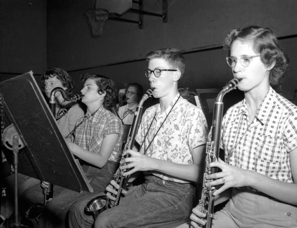 Robert Blum (second from right) of Evansville plays in the All-State High School Band with other students at the University of Wisconsin high school music clinic.