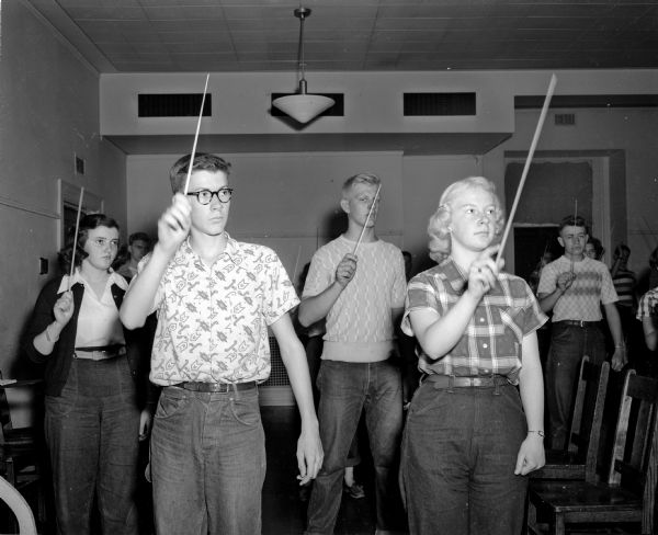 Robert Blum of Evansville, front row left, attends a conducting class with other students at the University of Wisconsin high school music clinic.