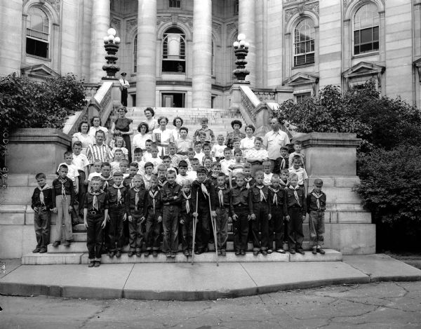 Cub Scouts from Richland Center and their den and pack leaders pose for a group portrait on the steps of the Wisconsin State Capitol Building in Madison, Wisconsin.
