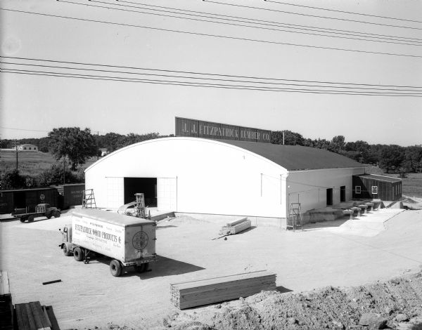 Elevated view of the exterior of Fitzpatrick Lumber Company at 3230 University Avenue, with a Fitzpatrick semi-truck in the foreground.
