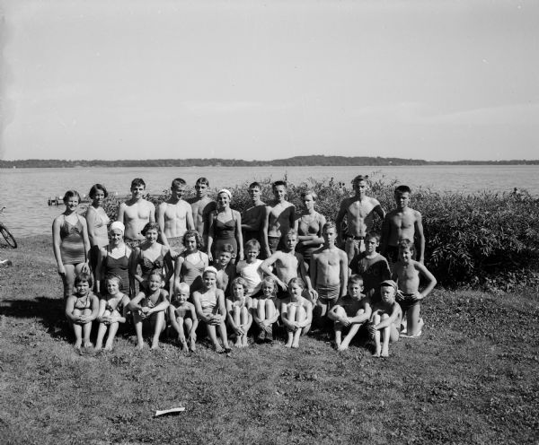 Group portrait of children and youth in swimsuits, winners of various events of the Madison city swimming meet held at the B.B. Clarke beach on Lake Monona.