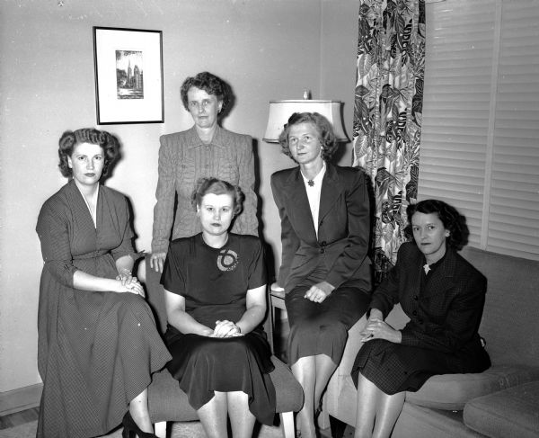 The officers of the Madison Army Officers' Wives Association gather for a group portrait. Seated from left to right are Mrs. Anthony Kalupy, treasurer; Mrs. Nelson L. Fisher, president; Mrs James Myers, secretary, and Mrs. Orin H. Reich, second vice-president.  Standing is Mrs. Eugene McPhee, first vice-president.