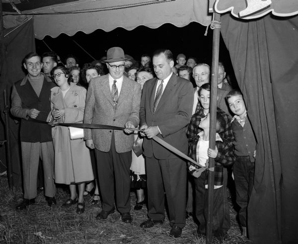 Madison's first home show in thirteen years was officially opened by Acting Manager George Forster when he cut the ribbon at the entrance to the exhibit area. The Home Show grounds are located on Richmond Hill along the 500 block of Olin Avenue.