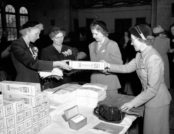 Mrs. Arthur Lillie, McFarland, third from the left, was elected new president of the Dane County Association of Health Councils and chairman of the diabetic committee. She is shown distributing diabetic equipment to other health council members; they are, from left: Mrs. Russell McCarthy, Cottage Grove; Mrs. Harold Jones, Oregon; Mrs. Lillie; and Mrs. Adolph Soucek, Mendota.