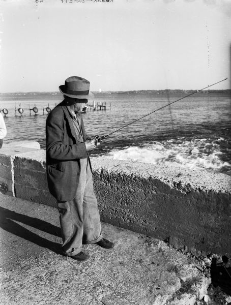 Ed Thompson of 921 Jenifer Street is shown fishing along the shore of Lake Monona behind Fauerbach's Brewery, located at 651-3 Williamson Street.