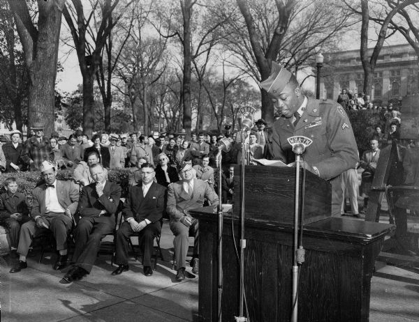 Corporal Albert Griffin, a soldier from Milwaukee wounded in the Korean War, addressing the crowd gathered at the Wisconsin State Capitol on United Nations Day.