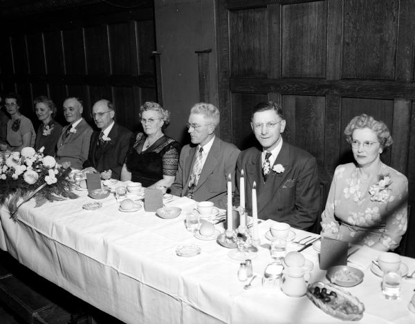 Seated at the speakers table are members of the Nansen Branch No. 43, of the Scandinavian American Fraternity. The banquet was held at the Park Hotel, 22 South Carroll Street. Left to right: Mrs. Irving (Ruby) Goff, 509 Maple Avenue, Madison; Mrs Orville Tranmel, Duluth, and her husband Orville, Grand President of the Fraternity; Oscar Christianson, Madison, toastmaster, Mrs. Albert (Marie) Bjerk, lodge president, and her husband Albert, 2506 Upham Street; Elmer Anderson, grand secretary of the fraternity, Eau Claire, and his wife.