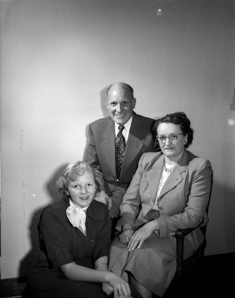 Portrait of Comdr. and Mrs. Elmer H. Schubert and, at left, their daughter, Virginia, visiting from Cincinnati, Ohio. During World War II, Comdr. Schubert was in charge of the Naval Training School on the UW campus and organized the school for WAVES (Women Accepted for Volunteer Emergency Service) in Madison.