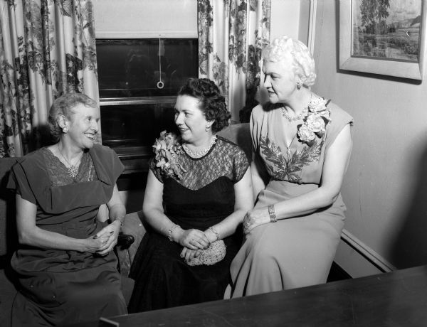 Three guests of honor gather at the Zor Shrine Banquet. They are, left to right: Mrs. A.R. (Pearl) Jennings, chairman of Zor Auxiliary; Mrs. Otto M. Gelein, Eau Claire; and Mrs. Oscar (Mary) Rennebohm, wife of Wisconsin's governor.