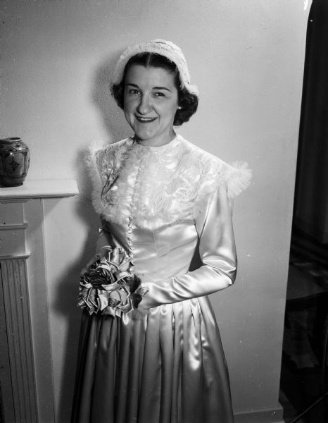 Portrait of Lois Schoman Salk, step-daughter of Louis Sakols and daughter of Willie Sakols, in her wedding dress.  She married Eugene Albert Lang on February 3, 1951.