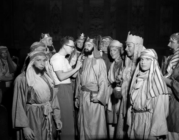 Actors dressed as kings and shepherds prepare for the 25th Yule performance in the State Capitol Building.
