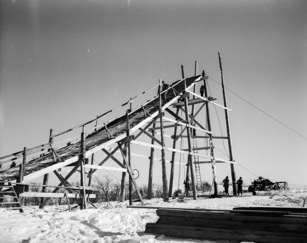 Men construct the Blackhawk Ski Club ski jump scaffold at Tomahawk Ridge.