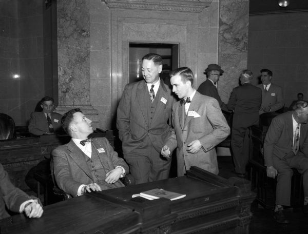 Milwaukee County Republican Assemblymen, from left to right: Harry F. Franke, Milwaukee; John E. Reilly Jr., Wauwatosa, and Walter L. Merten, Milwaukee, all beginning their first terms, conferring at the "school" for new legislators.