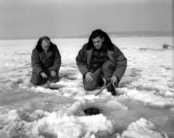 Russ Bartholomew, left, and "Bud" Bond ice fish on Lake Mendota.