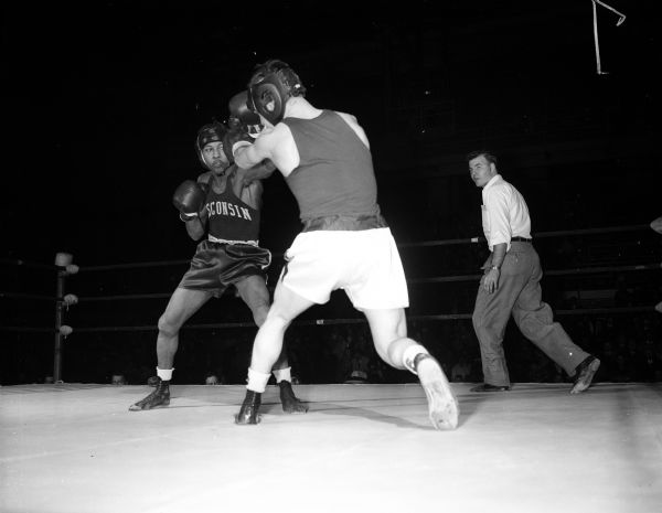 Charles Hopkins, a former Madison Central High School athlete, boxes in the all-university tournament at the University of Wisconsin-Madison Field House.