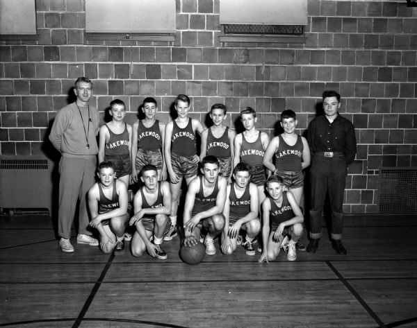 Group portrait of the undefeated Lakewood Elementary School boys' basketball team, winner in nine straight Madison Suburban Grade School League games.
Front row left to right: B. Coughlin, Dave Baskerville, Jim Schneiders, Johnny Coombs, and Jim Sexton. Back row: Coach Bill North, Bill Ela, Dick Lino, Tom Dean, Doug Tormey, Jack Sprague, Dave Williamson, and Jack Waters, manager.