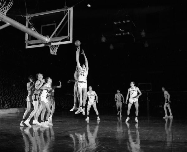 A University of Wisconsin player (#41) attempts a basket during the basketball game against the University of Iowa. Wisconsin lost to Iowa 73-60.