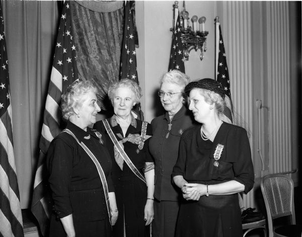 Leaders of the Wisconsin chapter of the Daughters of the American Revolution (DAR) gather at the fifty-fifth annual state convention. They are, (left to right): Mrs. E.M. Hale, Eau Claire, state regent; Mrs. Walter Pomeroy, state regent of Michigan; Mrs. W.L. Clark, Racine, president of the State Officers' club; and Mrs. G.A. Parkinson, Milwaukee, state chaplain.