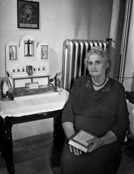 Mrs. Catherine Coffey at St. Mary's hospital, 720 South Brooks Street, where she lives and works as a dietary helper. The Dane County Red Cross was responsible for bringing Mrs. Coffey's son, Sergeant Daniel Coffey, home on leave from Okinawa when her daughter was seriously ill.
