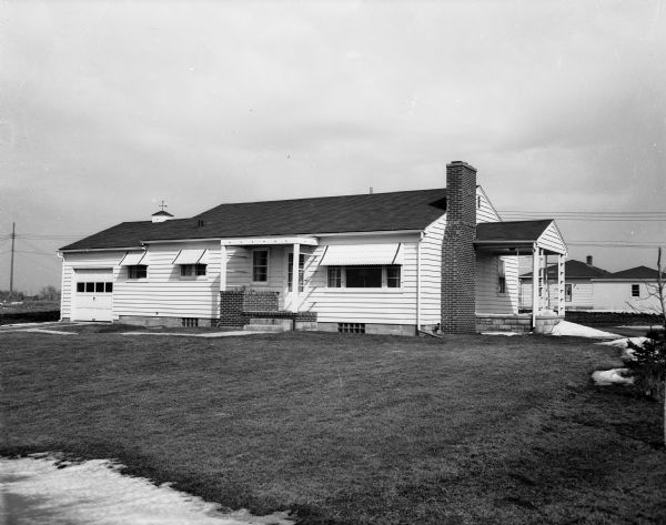 Exterior view of the Francis T. Hanson house, located at 717 Redland Drive in the Burke Heights subdivision. It was built by the Bewick Building Company at 101 Van Deusen Street.