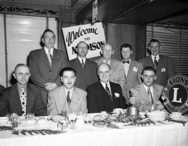 Officers of the Lions Club from District 27-D meet in the Park Hotel to honor their director-general, R. Roy Keaton, Chicago. Left to right, front row, are: Emil Gehrke, Reedsburg; G.I. Wallace, Madison; Keaton; and William C. Goebel, Madison Lions president. Back row Henry Schmid, New Glarus; Len Porter, Cuba City; William Nobel, Baraboo; Ed Hofmeister, Hillsboro; and E. K. Steul, Madison. Wallace is district governor. Gehrke and the men in the back row are deputy district governors.