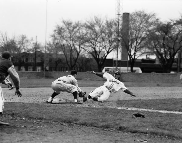 Ron Barbian, first baseman for the University of Wisconsin baseball team, gets thrown out at third base during a University of Wisconsin vs. University of Illinois game at Breese Stevens Field.