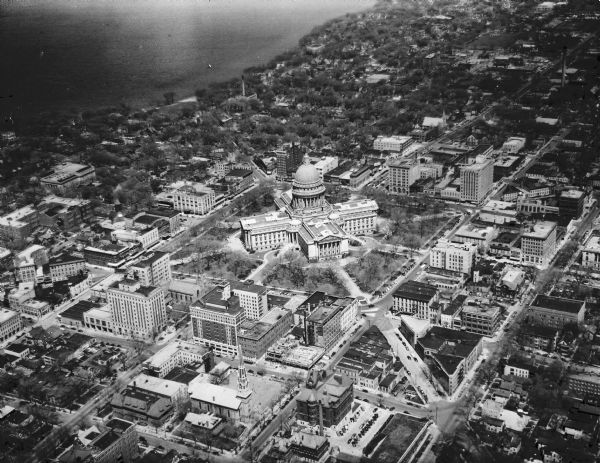 Aerial view of downtown Madison in the before construction of the Wisconsin Telephone Company in 1947 at the corner of South Fairchild Street and East Main Street. View is looking up South Hamilton Street.