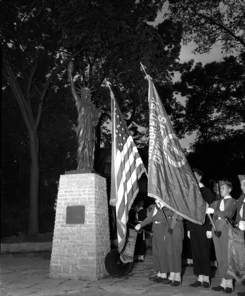 The Boy Scout color guard participates in the dedication of a miniature replica of the Statue of Liberty in Giddings Park, 944 Sherman Avenue at East Gorham Street.