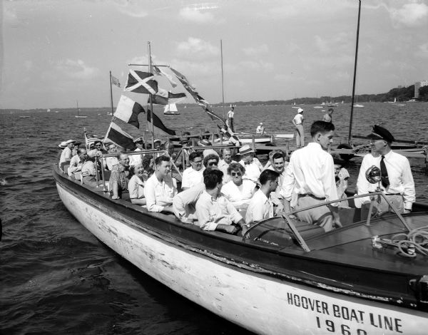 A Hoover Boat Company boat, with fourteen Madison aldermen and their parties, is taken on a tour of Lakes Mendota and Monona and the Yahara River.