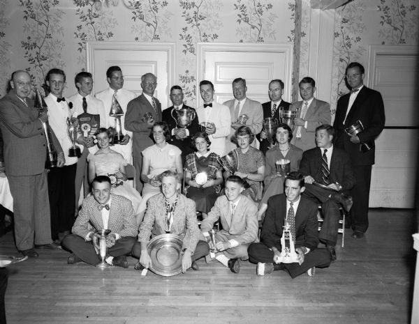 Mendota Yacht Club members posing with their trophies at the Yacht Club's annual banquet, held at Maple Bluff Country Club, 500 Kensington Drive.