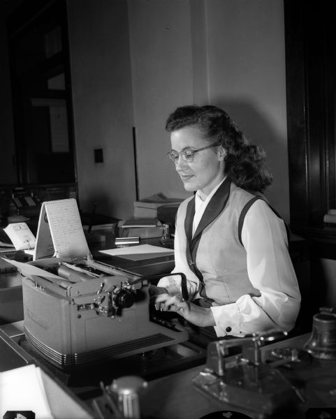 Doris Turner of 929 East Johnson Street sits at a desk while typing. She is the private secretary for Thomas E. Coleman and Joseph A. Coleman, president and vice-president, respectively, of the Madison Kipp Corporation.