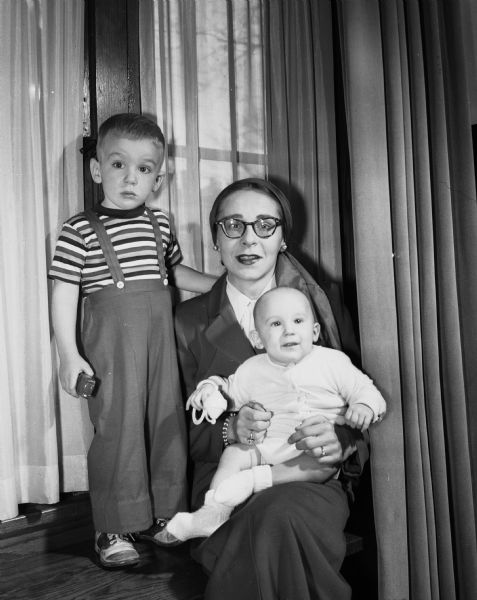 Mrs. Frances Mae Linn with her two sons, Robert Jr. and Steven Baker, before they left to join Lieutenant Linn who is serving in the U.S. Air Force in the Pacific.