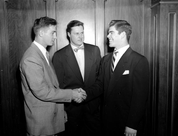 Shown, left to right, are: Jim Hammond, retiring U.W. football 1951 captain; Hal Faverty, who was named most valuable player; and George O'Brien, 1952 captain.