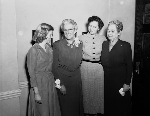 Miss Ida Collings, second from the left, is honored for her twenty-five years as superintendant of nurses at Madison General Hospital at a reception given by the Madison General Hospital Nurses' Alunmae Association. Left to right: Amy Birkett, Pestigo, a beginning student nurse at the hospital; Miss Collings; Mrs. Robert (Bernice) Keown, Elkhorn, a member of Miss Collings' first nursing class, and Miss Grace Crafts, administrator of the hospital.