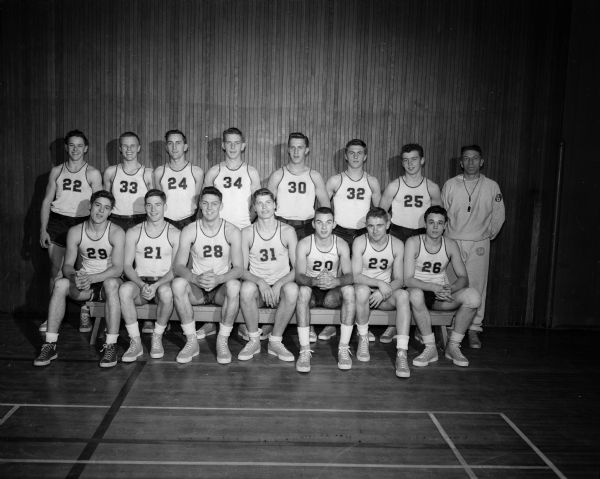 The East High School basketball team plays in the Holiday Doubleheader games at the University of Wisconsin-Madison Field House. This is the seventh annual charity doubleheaders.