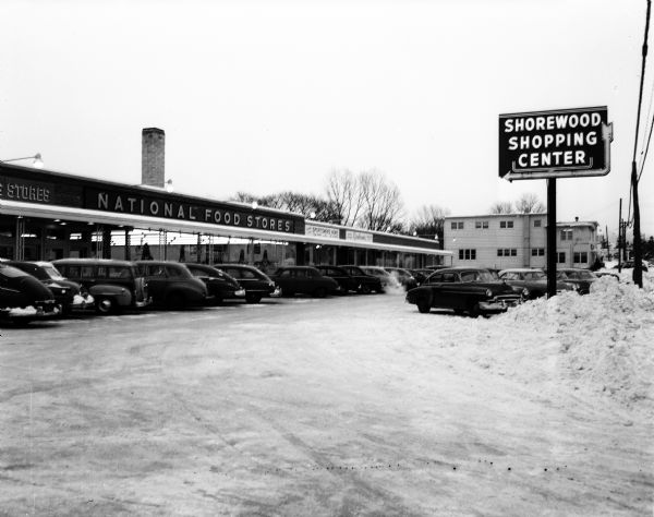 View of the Shorewood Shopping Center parking lot, including the National Food Store, looking east. The shopping center was located in Shorewood Hills.