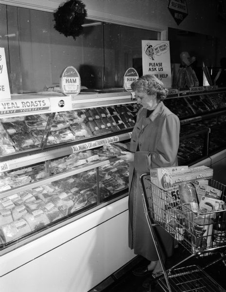 A woman shops for meat at the National Food Store in the Shorewood Shopping Center, located at 3244 University Avenue in Shorewood Hills.