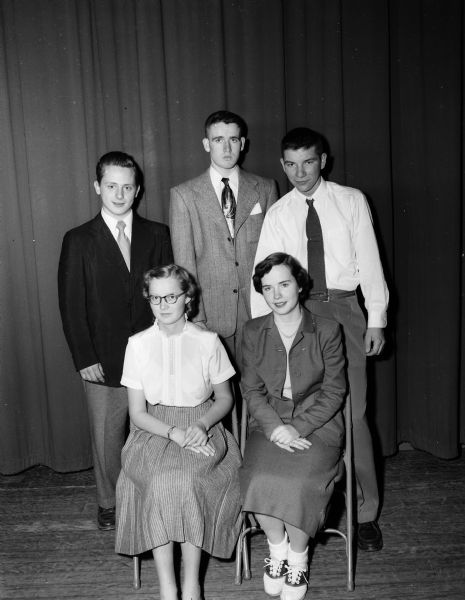 Group portrait of five Edgewood High School students on a committee to plan the school's Senior Ball. Sitting are Virginia Ripp, left and Peggy Cafferty. Standing, left to right: Wayne Pertzborn, Patirck Lynch and Thomas Coenen.