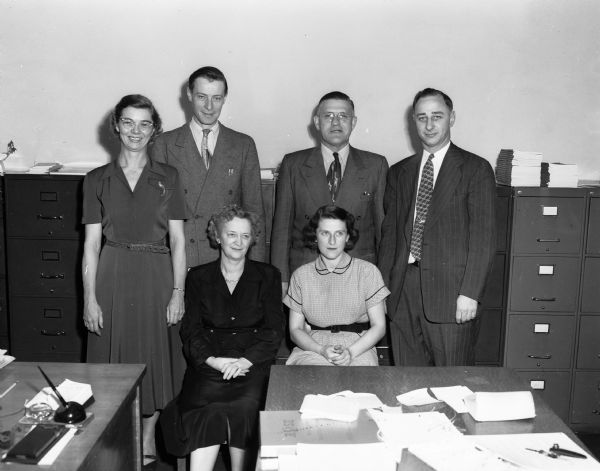 Group portrait of staff members of the Madison Recreation Department, left to right: Standing, Hermine Sauthoff, Clarence Schwengel, Glenn "Pat" Holmes and Frank Blau. Sitting, Eva Kuhlman and Delores Kuntz.