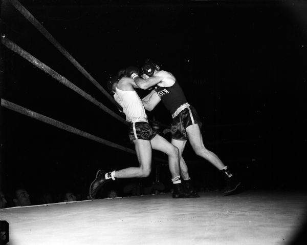Action shot of Bobby Morgan, Duluth, and Pat Greeman, Beloit, boxing in the 147-pound-division during the championship finals of the UW boxing tournament.
