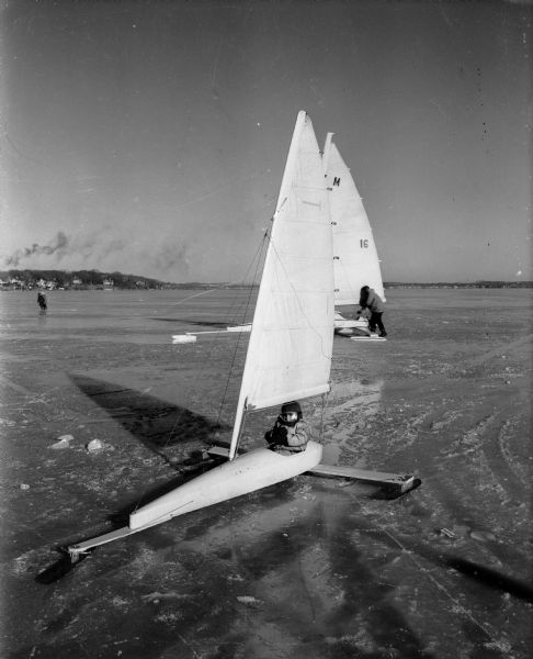 Portrait of five-year-old William (Spike) Boston, the son of national champion Howard Boston, in his iceboat on Lake Monona. He was the youngest skipper in the Northwestern Ice Yachting Association ice regatta.