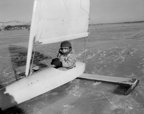 Close-up of five-year-old William (Spike) Boston in his iceboat on Lake Monona. He was the youngest skipper at the Northwestern Yachting Association ice regatta.