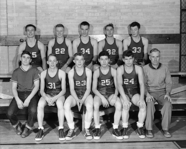 Goup portrait of the Sun Prairie high school boys basketball team.