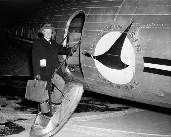 Senator Robert A. Taft of Ohio, a Republican Presidential candidate, prepares to board a Wisconsin Central airplane in Madison after meeting with supporters. Taft was then finishing a two-day tour of Wisconsin. Because of the early date of the Wisconsin Presidential primary (April 1) and the controversial status of Wisconsin's junior senator, Joseph R. McCarthy, the Wisconsin race had great importance. Addressing an audience in Monroe, Taft made his support of McCarthy clear.