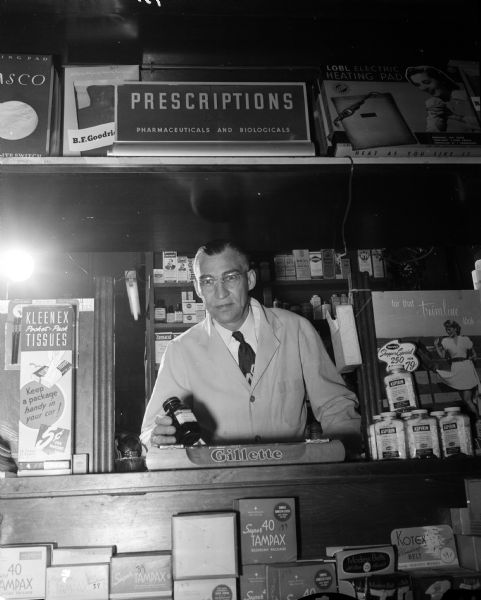 Portrait of Orson M. Branton, registered pharmacist since 1920.  He owns the Branton Pharmacy located at 2042 East Washington Avenue.