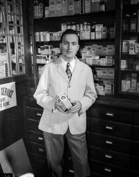 Portrait of Donald A. Bongey, a registered pharmacist who, with his father Alf Bongey, owns Bongey's Pharmacy, 335 W. Lakeside Street.