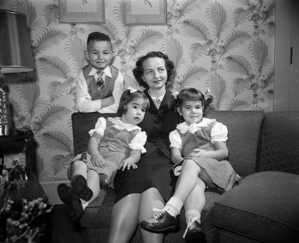 Shown are newcomers to Madison, Esther T. (Mrs. J. W. Sidney) Gallagher, 2025 Chadbourne Avenue, and her three children, left to right, Dick, Kathleen, and Sharon.