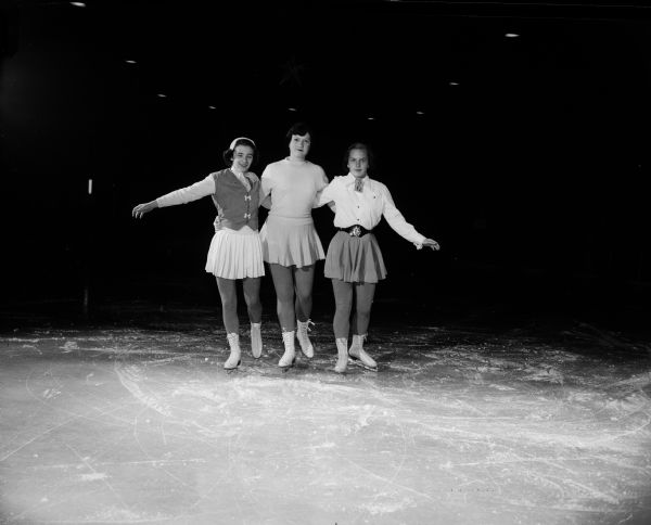 Three teanage girls gather regularly at the Truax ice arena of the Madison Skating Club.  From left, they are: Carolyn Freeman, Katy Grimmer, and Valerie White.